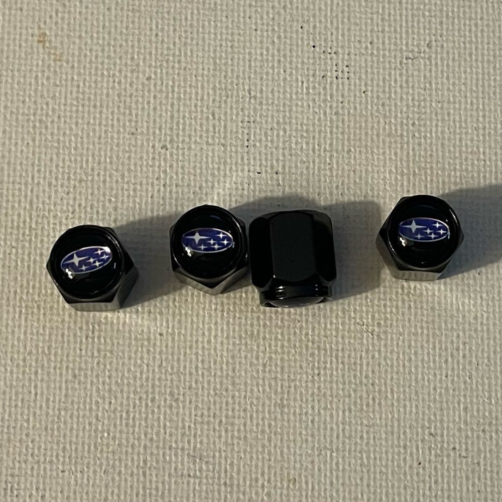Subaru logo valve Stem caps in black set of 4 NWT